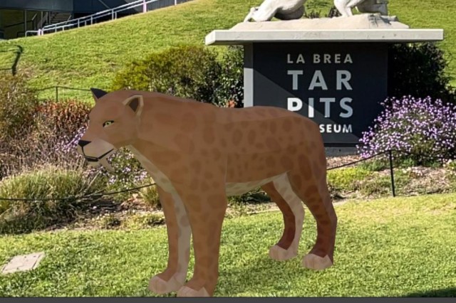 Augmented Reality saber-toothed cat in front of the Tar Pits Museum