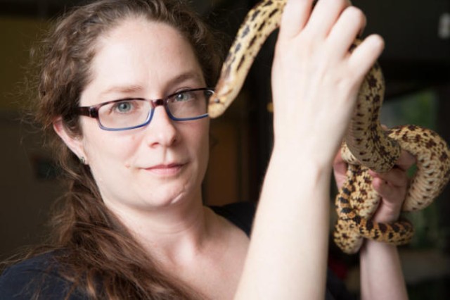 Dr. Leslie Gordon of NHM holding a snake
