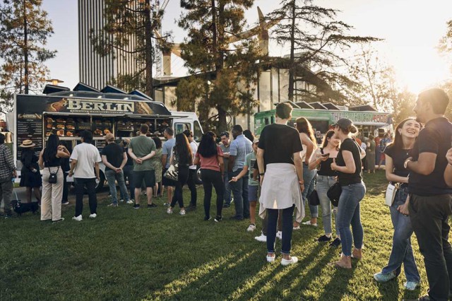 Visitors in line for a food truck