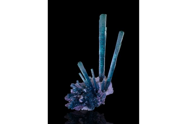 Blue square-shapes shooting out and upwards from a purple crystal base