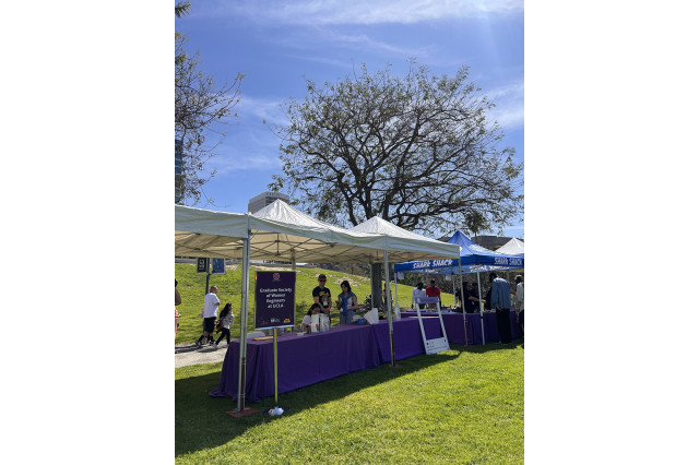 Row of tables under tents outside