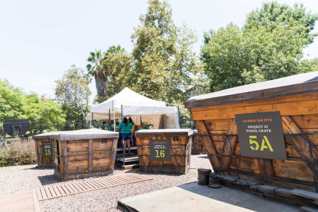 Large crates with a tent in the background