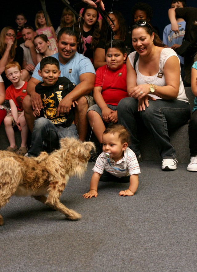 Nibbles the small Saber-Toothed Cat puppet during Tar Pits Ice Age Encounters Show
