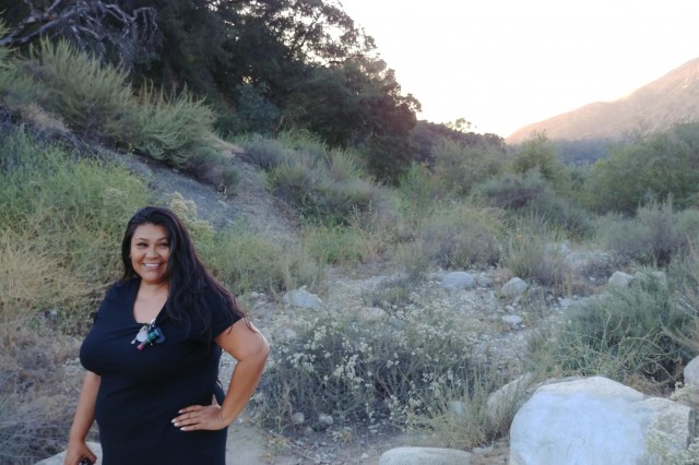 Brenda Kyle stands in the dry creek bed at Eaton Canyon
