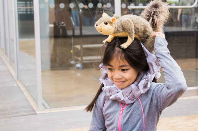 squirrel on girl&#039;s head