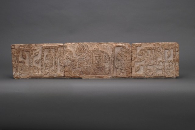 Rectangular stone with Maya glyph depicting a man holding a cacao plant. Campeche, Mexico. AD 600-900.