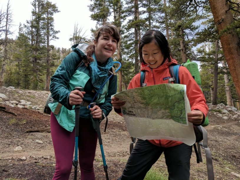 Helen and friend Ashley Atkinson reading a topo map during a training hike.