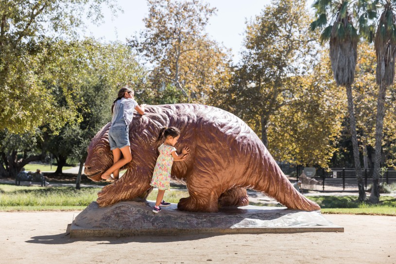 Climb the sloth statue