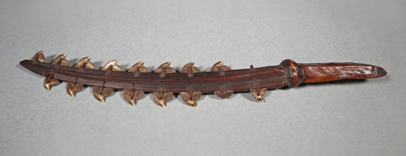 Sword made of wood with shark teeth on edge 