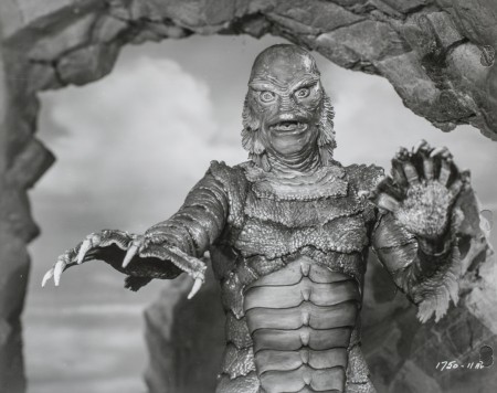 The fishy creature with arms outstretched, a still from the film The creature from the black lagoon.