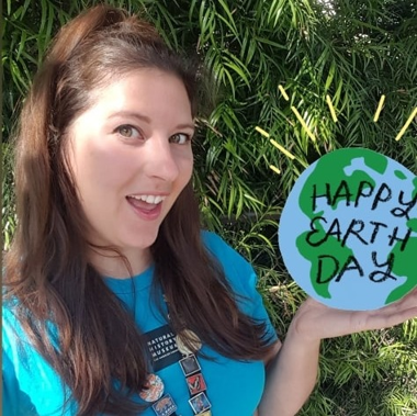 Woman holing happy earth day globe